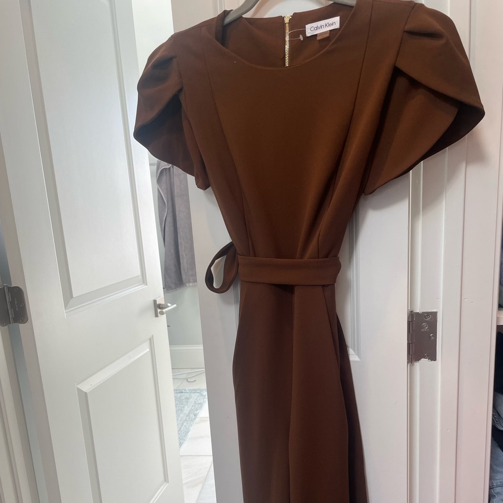 Brown Calvin Klein jumpsuit.  Tied at sleeves. Bell sleeves